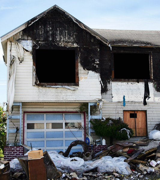 Rebuilding fire-damaged structure in Orange County by Top Shelf Restoration